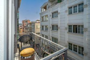 a balcony with a chair on a balcony at Robin Hotel in Istanbul