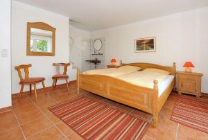 Ein Bett oder Betten in einem Zimmer der Unterkunft Ferienwohnungen Haus Taddigshus
