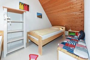 Ein Bett oder Betten in einem Zimmer der Unterkunft Ferienwohnungen Haus Taddigshus