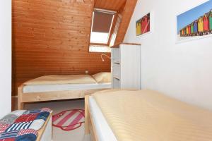 Ein Bett oder Betten in einem Zimmer der Unterkunft Ferienwohnungen Haus Taddigshus