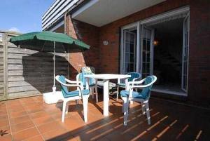 Ein Balkon oder eine Terrasse in der Unterkunft Ferienwohnungen Haus Taddigshus