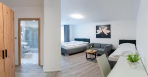 Posteľ alebo postele v izbe v ubytovaní Apartmány LAGUNA