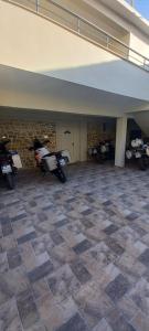 a garage with two motorcycles parked in it at Vila BABE in Vlorë