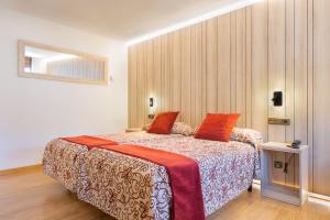 Voodi või voodid majutusasutuse Hotel Eth Solan & SPA toas