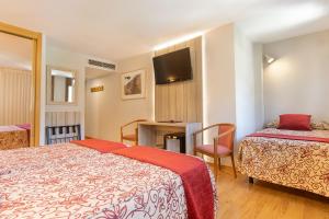 Voodi või voodid majutusasutuse Hotel Eth Solan & SPA toas