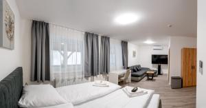 Postel nebo postele na pokoji v ubytování Apartmány LAGUNA