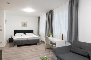 Posteľ alebo postele v izbe v ubytovaní Apartmány LAGUNA