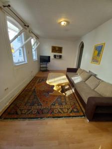 a living room with a couch and a coffee table at Ferienhaus Sankt Goar E in Sankt Goar