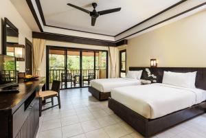 Postel nebo postele na pokoji v ubytování Nang Thong Beach Resort