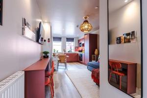 a kitchen and living room with a bar and a dining room at Luxury 2B City Centre Apartment with Private Parking in Chester