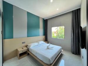 Posteľ alebo postele v izbe v ubytovaní 悦榕庄别墅酒店新装修店