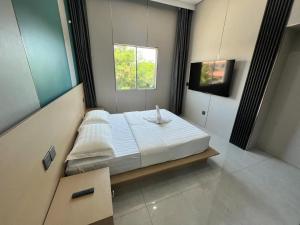 Posteľ alebo postele v izbe v ubytovaní 悦榕庄别墅酒店新装修店