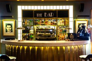 a bar with a sign that reads the bad at Browns Central Hotel in Lisbon
