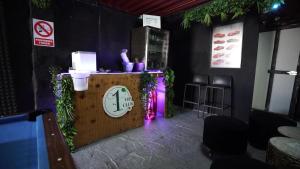 a restaurant with a counter with a purple light at La casa de las nieves in Hondón de las Nieves +33 photos