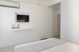 Postel nebo postele na pokoji v ubytování HAO Hotel Phuket