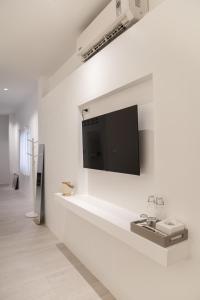 TV a/nebo společenská místnost v ubytování HAO Hotel Phuket