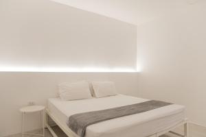 Postel nebo postele na pokoji v ubytování HAO Hotel Phuket