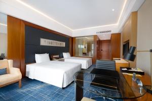 Postel nebo postele na pokoji v ubytování Four Points by Sheraton Suzhou