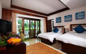 Postel nebo postele na pokoji v ubytování the ocean resort samui + 37 fotografií