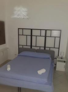 Ένα ή περισσότερα κρεβάτια σε δωμάτιο στο DonnA RitA