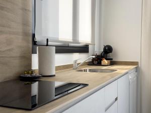 Kuchyň nebo kuchyňský kout v ubytování Apartamentos Clotilde