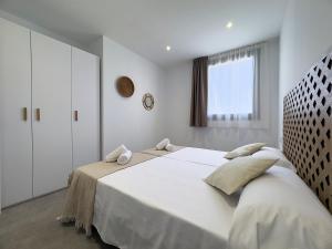 Postel nebo postele na pokoji v ubytování Apartamentos Clotilde