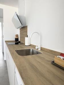 Kuchyň nebo kuchyňský kout v ubytování Apartamentos Clotilde