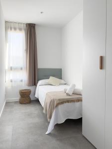 Postel nebo postele na pokoji v ubytování Apartamentos Clotilde