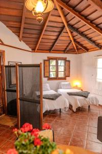 Ένα ή περισσότερα κρεβάτια σε δωμάτιο στο La Paredita Casa Guimar