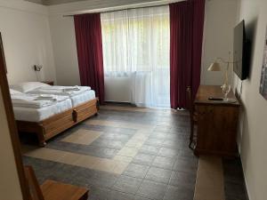 Posteľ alebo postele v izbe v ubytovaní Apartmány LAGUNA
