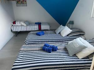 Postel nebo postele na pokoji v ubytování La Villa KEROMER