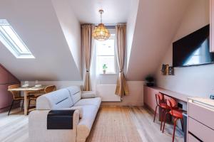 a living room with a couch and a table at City Centre Apartment Free Parking and Luxury Finishes in Chester