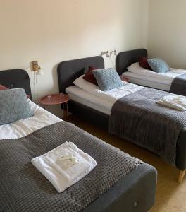 Postel nebo postele na pokoji v ubytování Snöå Bruk Hotell och konferens
