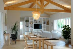 a living room with a table and a couch at La villa aux oiseaux in Andernos-les-Bains