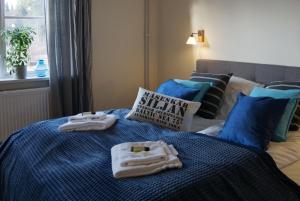 Postel nebo postele na pokoji v ubytování Snöå Bruk Hotell och konferens
