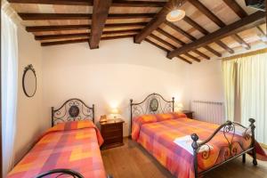 Postel nebo postele na pokoji v ubytování Agriturismo Rocca del Nera