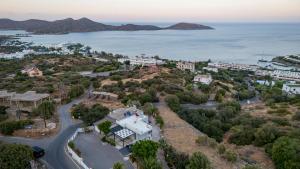an aerial view of a city and the ocean at Elounda Buena Vista Apartment in Elounda