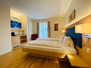 Tempat tidur dalam kamar di Hotel Felmis SELF CHECK-IN