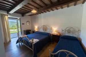 Postel nebo postele na pokoji v ubytování Agriturismo Rocca del Nera
