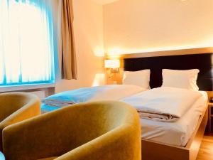 Tempat tidur dalam kamar di Hotel Felmis SELF CHECK-IN