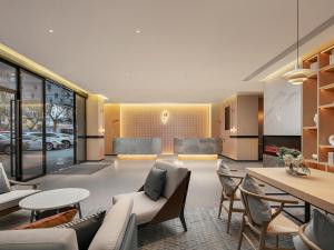 Posezení v ubytování Country Inn & Suite by Radisson, Guangzhou Railway Station Xiaobei