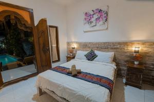 En eller flere senge i et værelse på The Mel Homestay