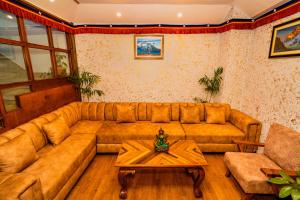 Un lugar para sentarse en Hotel Aashraya Home