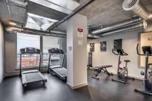 a gym with treadmills and cardio equipment in a building at Blueground Tacoma gym elevator lounge wd SEA-773 in Seattle