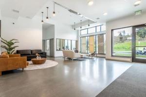 a large living room with couches and chairs at Blueground Tacoma gym elevator lounge wd SEA-773 in Seattle