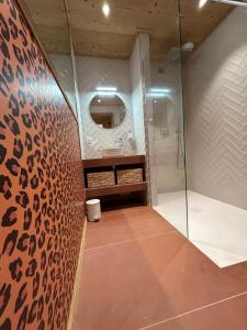 a bathroom with a shower with a glass door at Chalet du Hazard in Gerbépal +27 photos