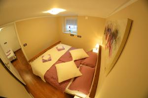 a view of a small bedroom with a bed at Apartment Arpa in Ljubljana