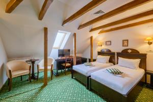 Postel nebo postele na pokoji v ubytování Hotel Classico Timisoara