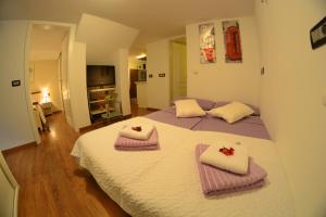 Postel nebo postele na pokoji v ubytování Apartment Arpa