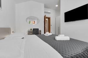 Postel nebo postele na pokoji v ubytování Villa Smokva and Višnja - Resort Moja Stina